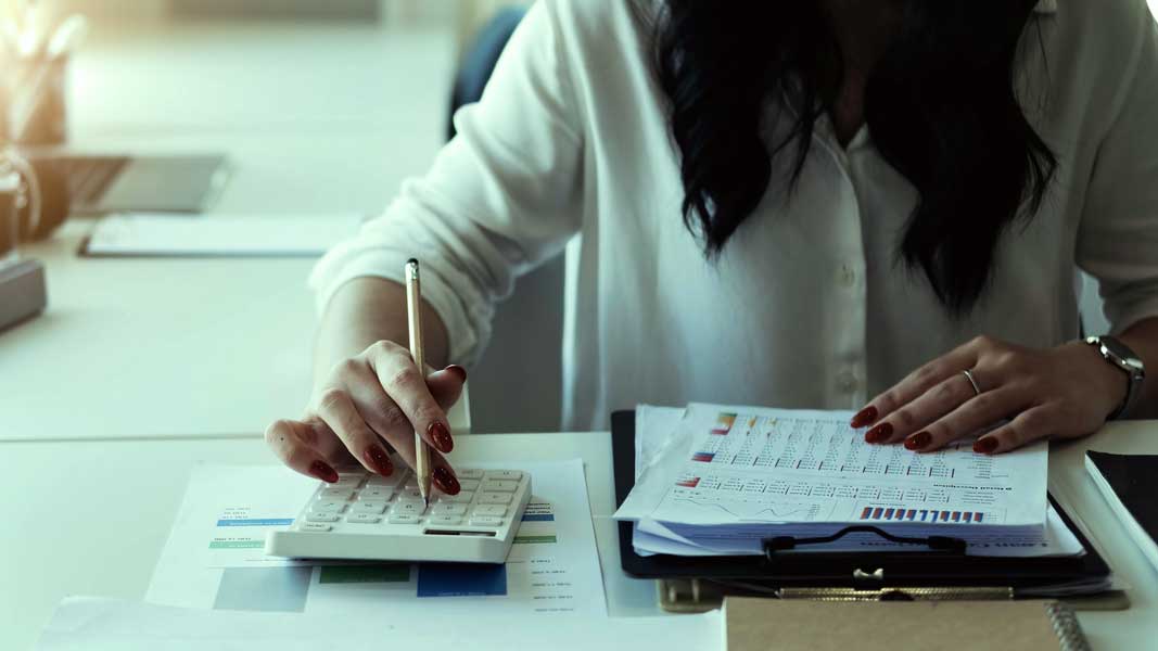 loan-office-evaluating-loan-application Loan officer evaluating loan application in Hawaii
