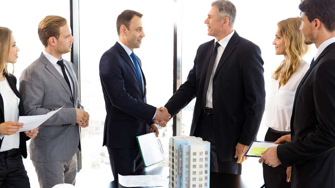 Real estate investor in Hawaii discussing project with local hard money lender