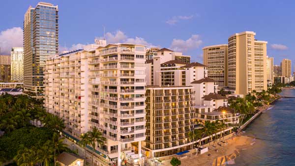 Aerial view of Waikiki beach AMD hotels at sunset Hawaii
