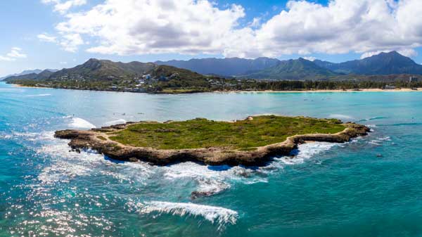 Areal view of Rocky Island and Turquoise waters in Oahu Hawaii