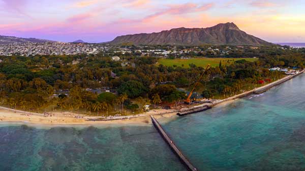 Waikiki beach and Diamond Head crater at sunset