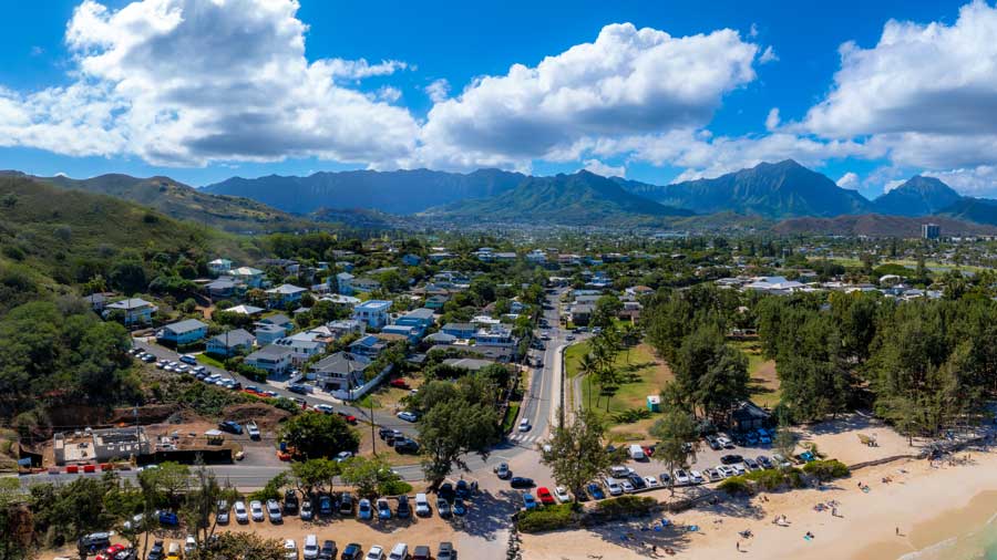  aerial view of sandy beach and residential area on Oahu island Hawaii