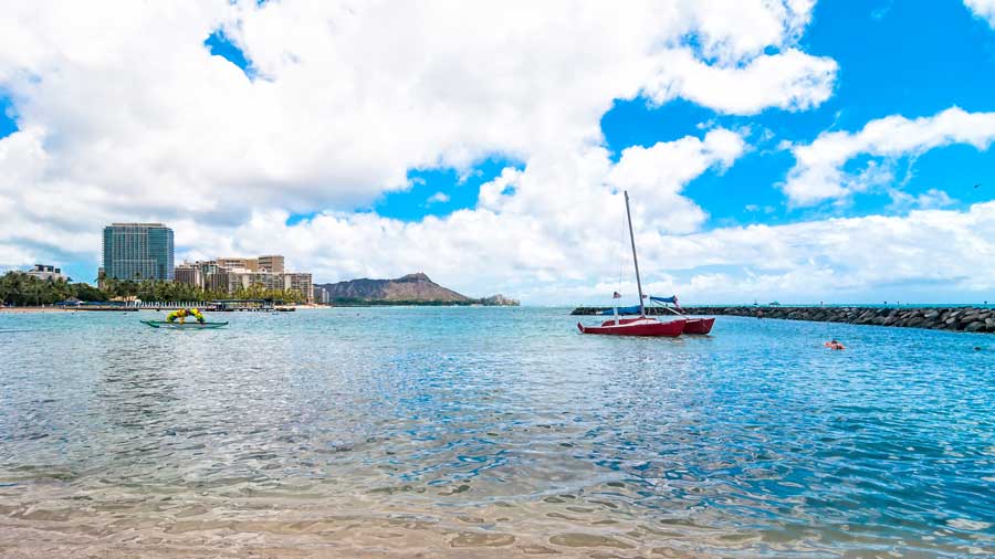 Waikiki shoreline with tourists in Honolulu Hawaii