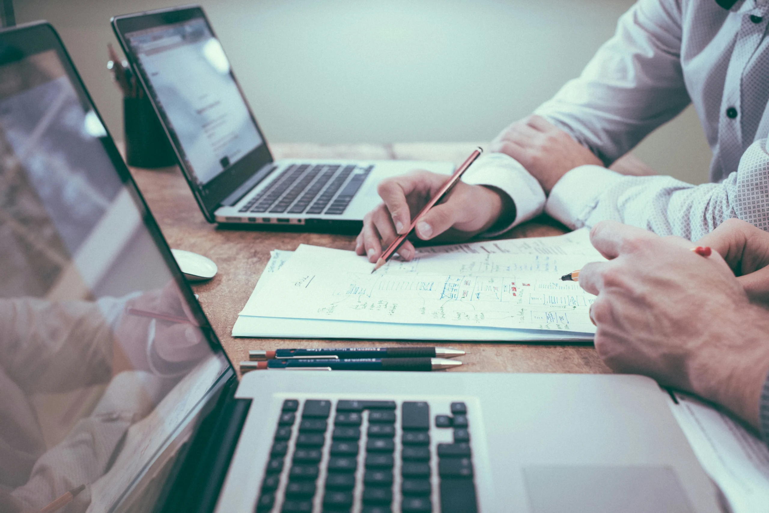 Photo-people-reviewing-fix-and-flip-loans-for-beginners-paperwork