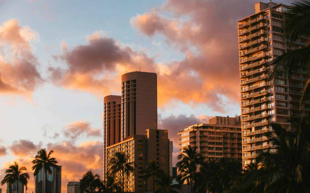 Photo-of-tropical-city-skyscrapers-glowing-under-dramatic-sunset-clouds_compressed_converted