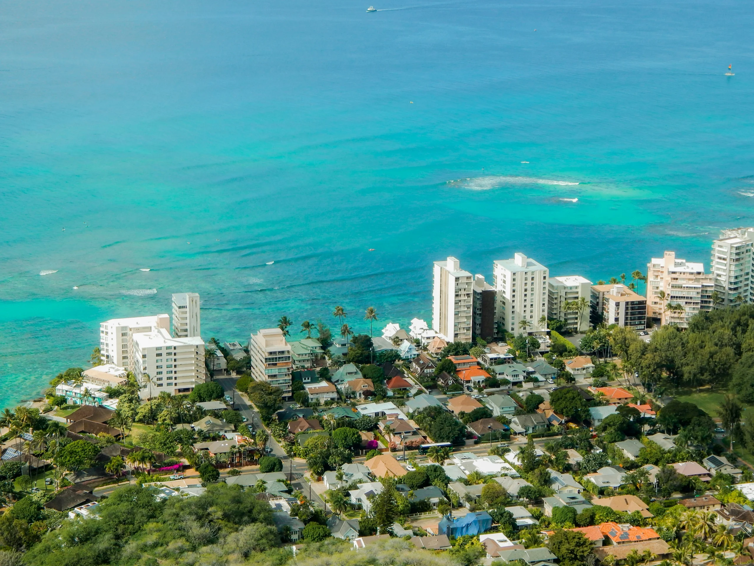 Photo-of-aerial-view-of-coastal-beachfront-homes-along-turquoise-ocean-water Photo-of-aerial-view-of-coastal-beachfront-homes-along-turquoise-ocean-water